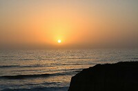 Zonsondergang op onze kust-kampeerplek