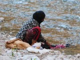Wassen in de rivier