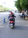 Lijiang - woman and baby on moterbike