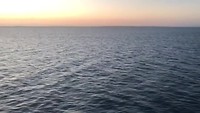 De zon gaat onder, op weg naar Tasmanie