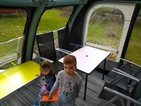 Ilan and Gwyn inspect their table and chairs