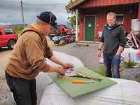 Farmer helping with the codfish