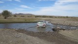 Ulgi-Khovd: auto door rivier.