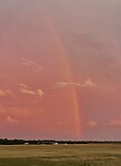 Regenboog bij zonsondergang