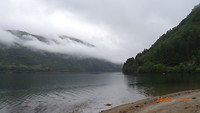 Strand met wolken