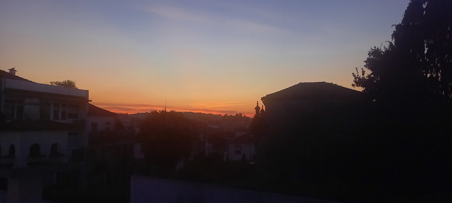 Ondergaande zon vanaf ons dakterras