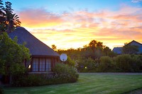 Zonsondergang bij Coral Tree Cottages