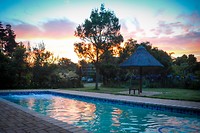 Zonsondergang bij Coral Tree Cottages