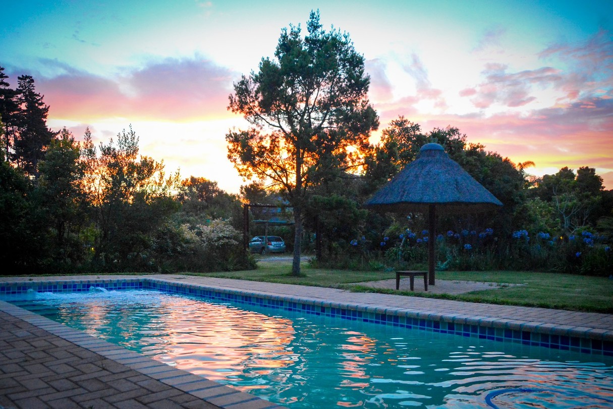 Zonsondergang bij Coral Tree Cottages