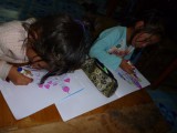 Marjolein sketched two castles and the two sweeties colouring them :)