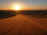 The sun lowers and touches the horizon and sets the dunes of fire!!... wonderful!!