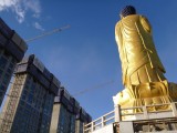 A large Buddha in front of the Zaisan hill, a 22 m high statue