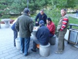 Guys like playing cards, chinese chess and mahjong - everywhere :)