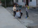 Little kids playing on the street