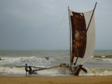 Fishermen coming ashore after taking over too much water...