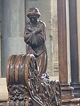 Houtsnijwerk bij de kerkbanken