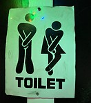 Bordje bij toilet in de pub