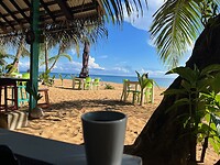 Uitzicht op strand vanuit restaurant hotel Island Plantation