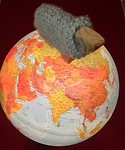 Sheepie op wereldbol
