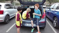 Soccer match, Cuno and his friends using my car as changing room....