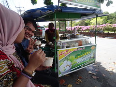 Eating coconut icecream with special toppings