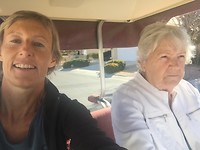 with auntie in the golf car