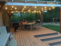 The deck looks festive with the lights on.