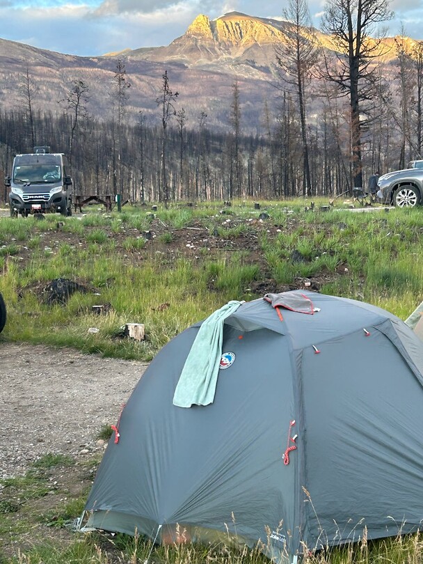 My tent with the beautiful view of the mountains, apart from the burned area