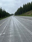 All puddles and washboard wet road ahead