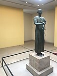 Wagenmenner van Delphi.Gaaf gebleven beeld van brons.