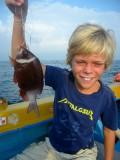 Koen heeft een mooie koraalvis gevangen