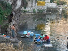 Doing their laundry in the lake