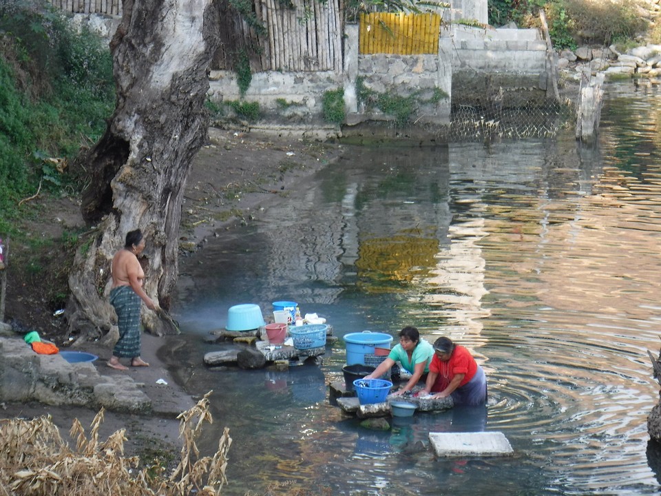 Doing their laundry in the lake