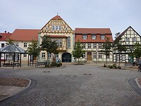 Het postkantoor, links