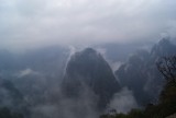 The surrounding mountains covered in mist