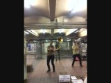 Musicians playing at the metro in NYC