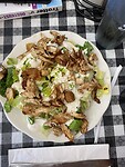 Koen koos voor een Caesars salad