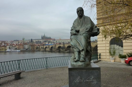 Statue of Bedřich Smetana in front of Moldau and Charles Bridge