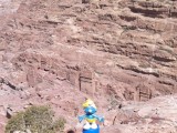 Smurf posing for tombs seen from above in Petra