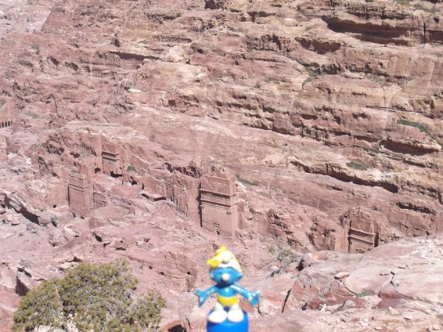 Smurf posing for tombs seen from above in Petra