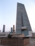 Building of New National bank of Kuwait behind preserved mosque
