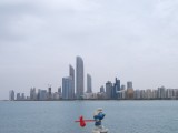 Smurf passing skyline of Abu Dhabi