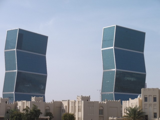 Zig Zag towers behind old style buildings