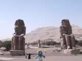 Smurf posing in front of Colossi of Memnon