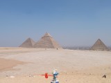 Smurf walking past Pyramids of Giza
