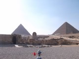 smurf passing pyramids while sunset comences