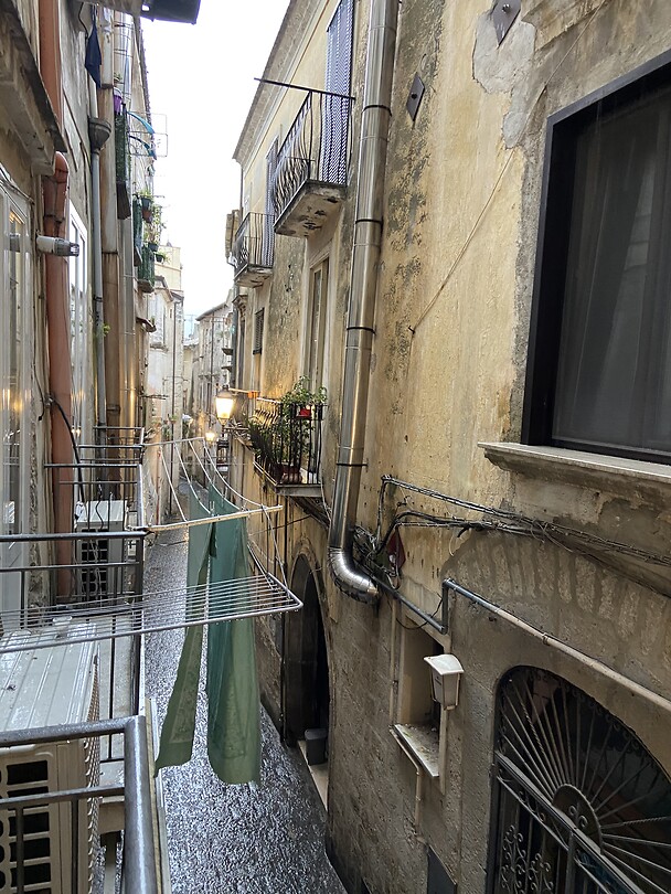 Street view from BnB balcony on a rainy day