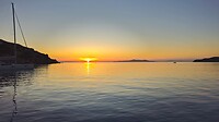 Ondergaande zon vanaf Kini, Syros