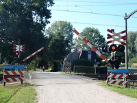 De spoorbomen gaan dicht!