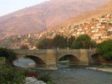 Huanuco - old colonial bridge and little houses build on the mountainsides